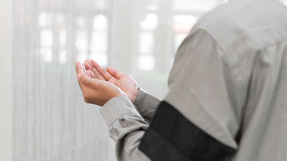 a man holding his hands together