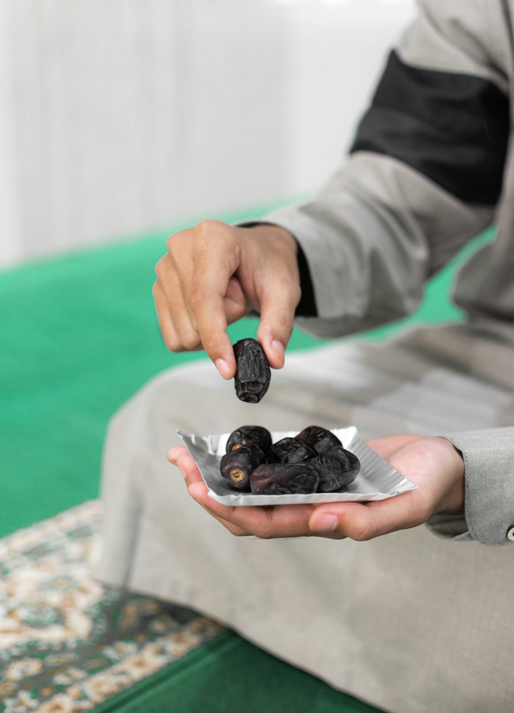 a person holding a small object