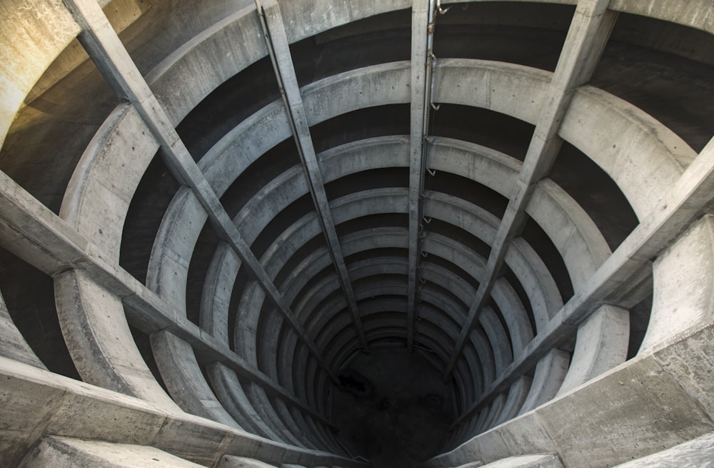 a circular staircase with a curved railing