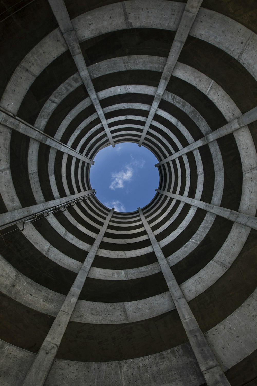 a circular staircase with a blue sky