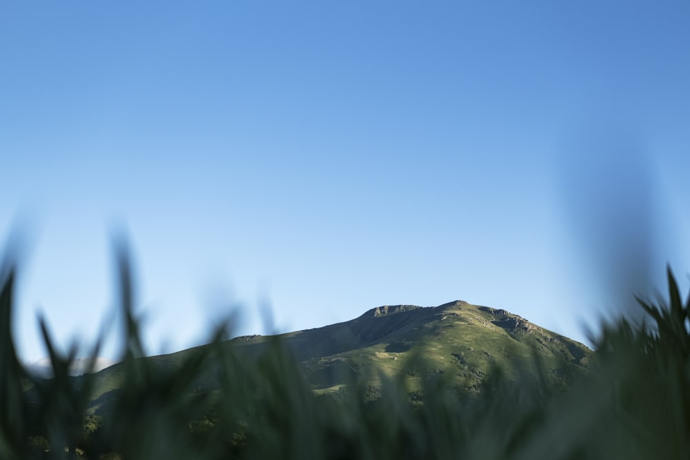 a mountain with a blue sky
