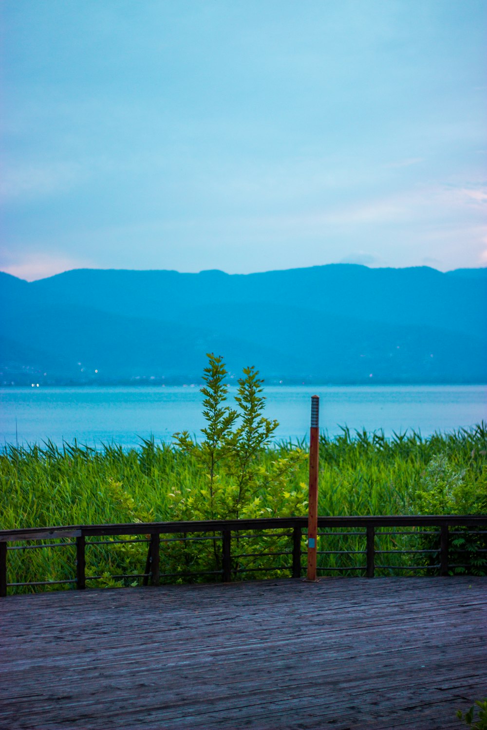 a wood deck overlooking a body of water