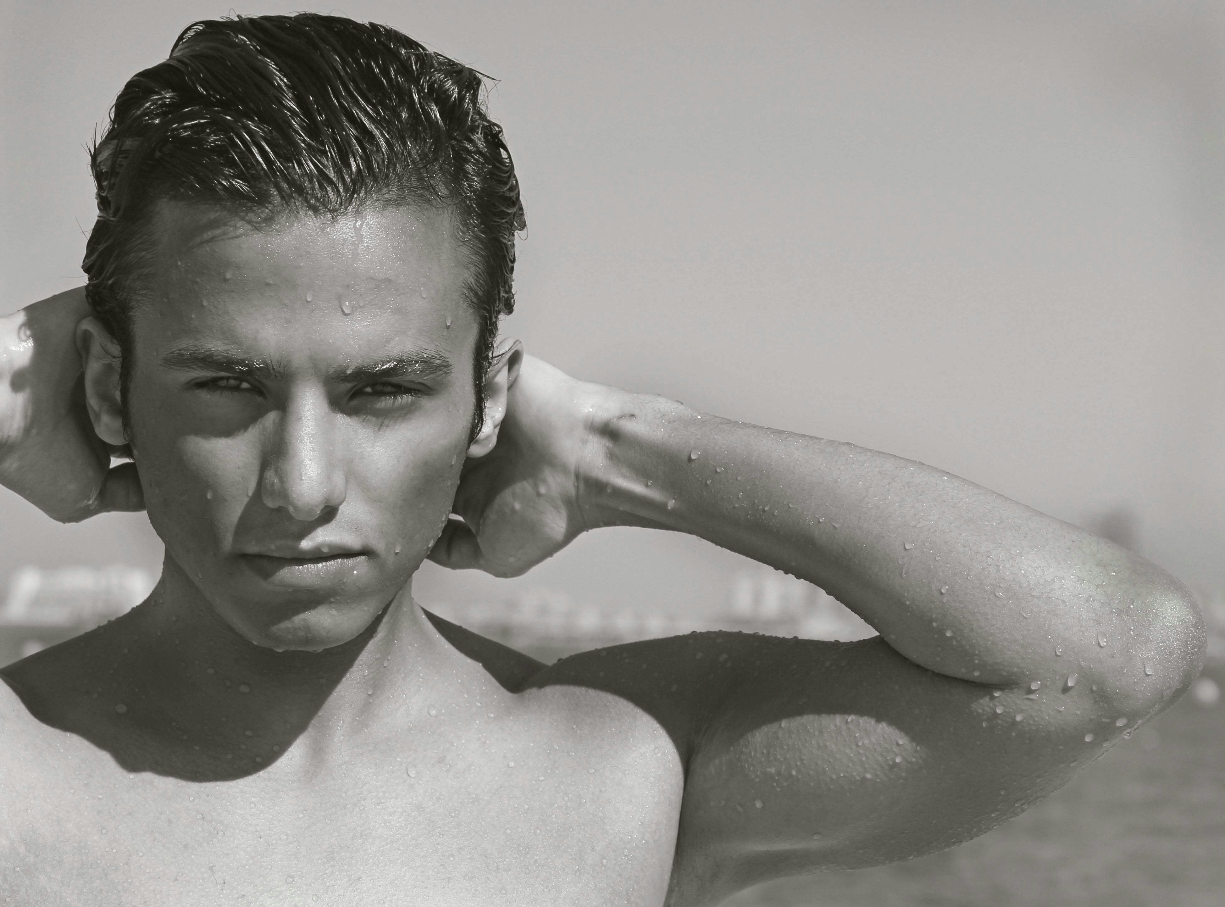 a man flexing his muscles, 