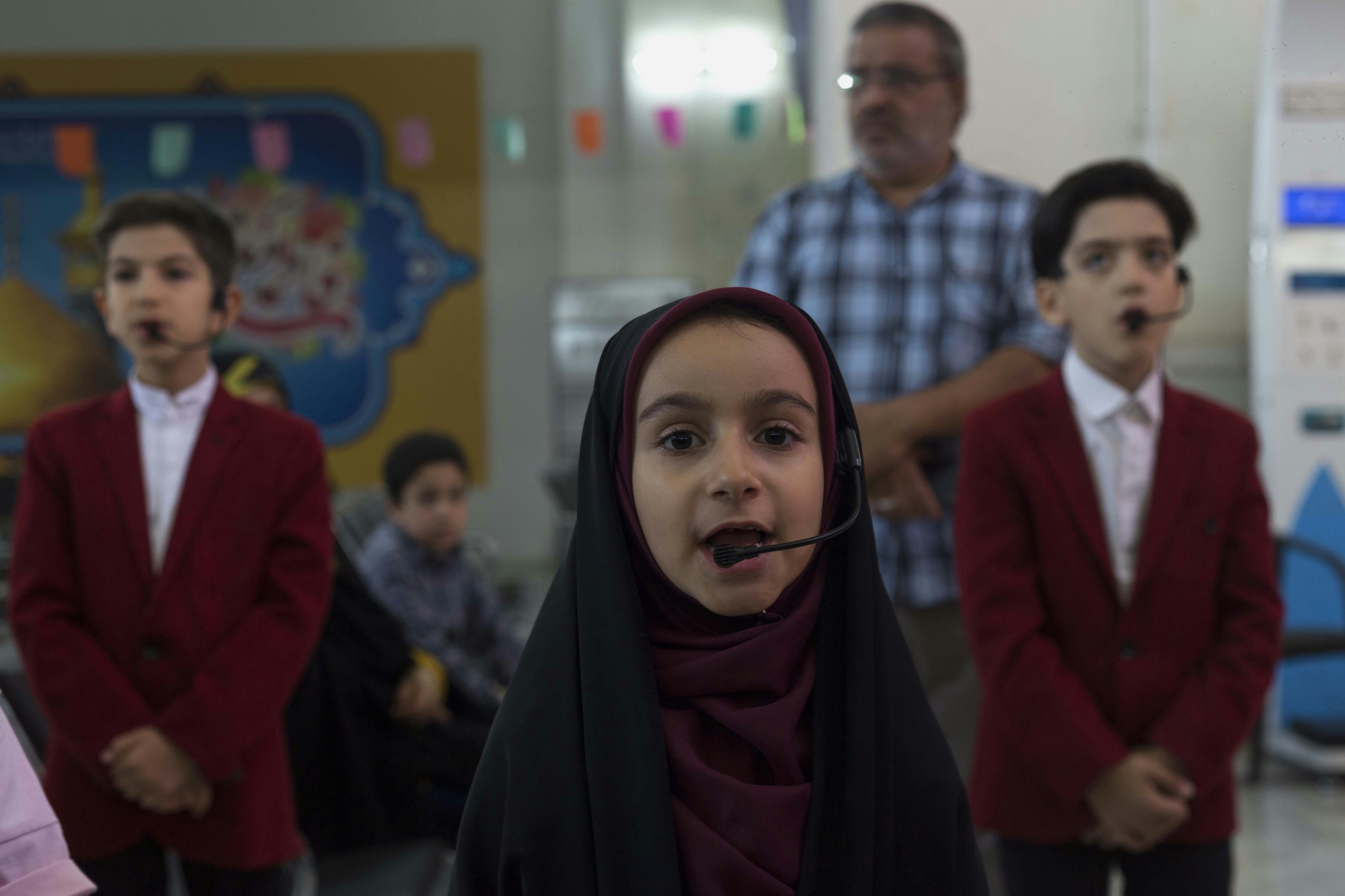 a group of people standing in a room