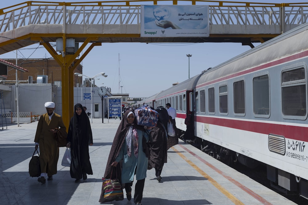 people waiting for a train