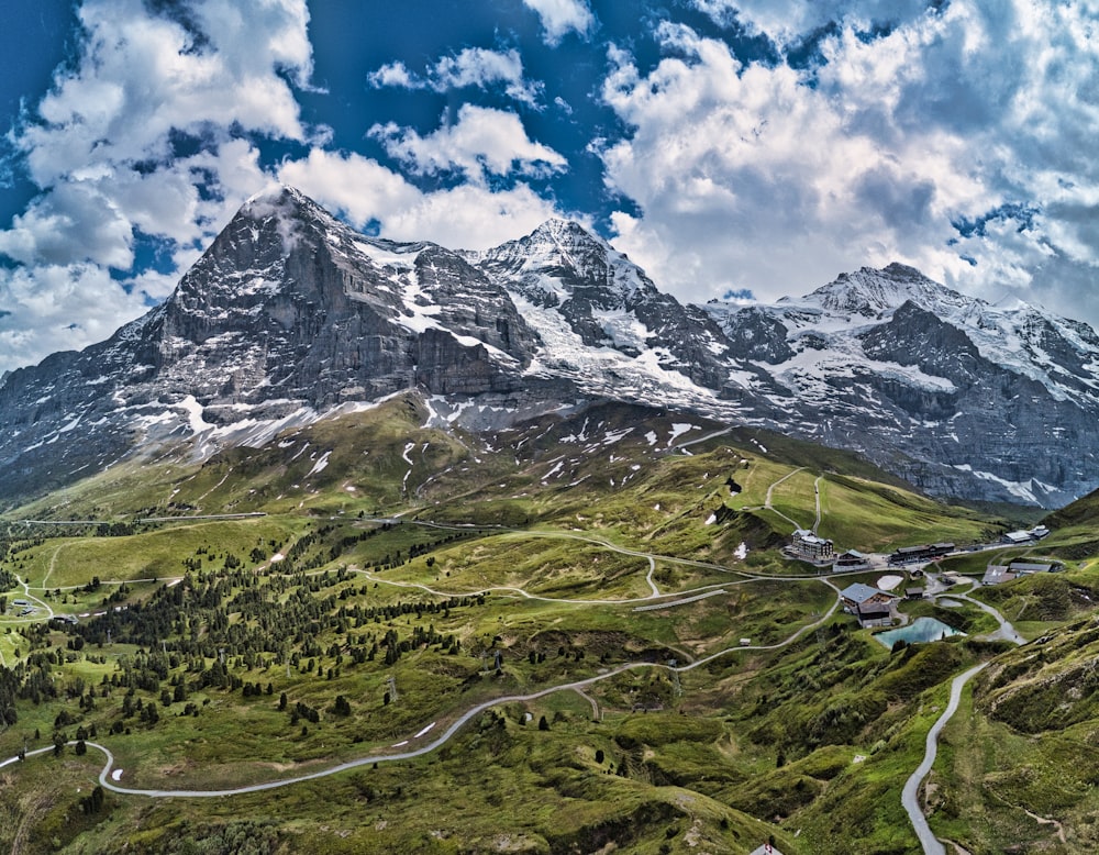 a valley between mountains with houses