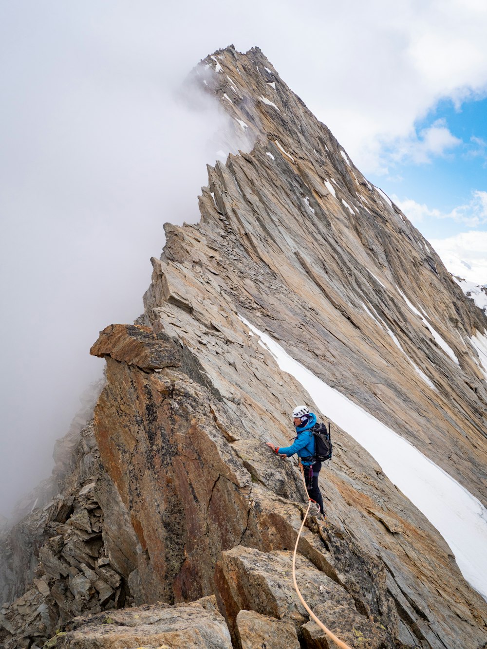 a man standing on a rocky hill