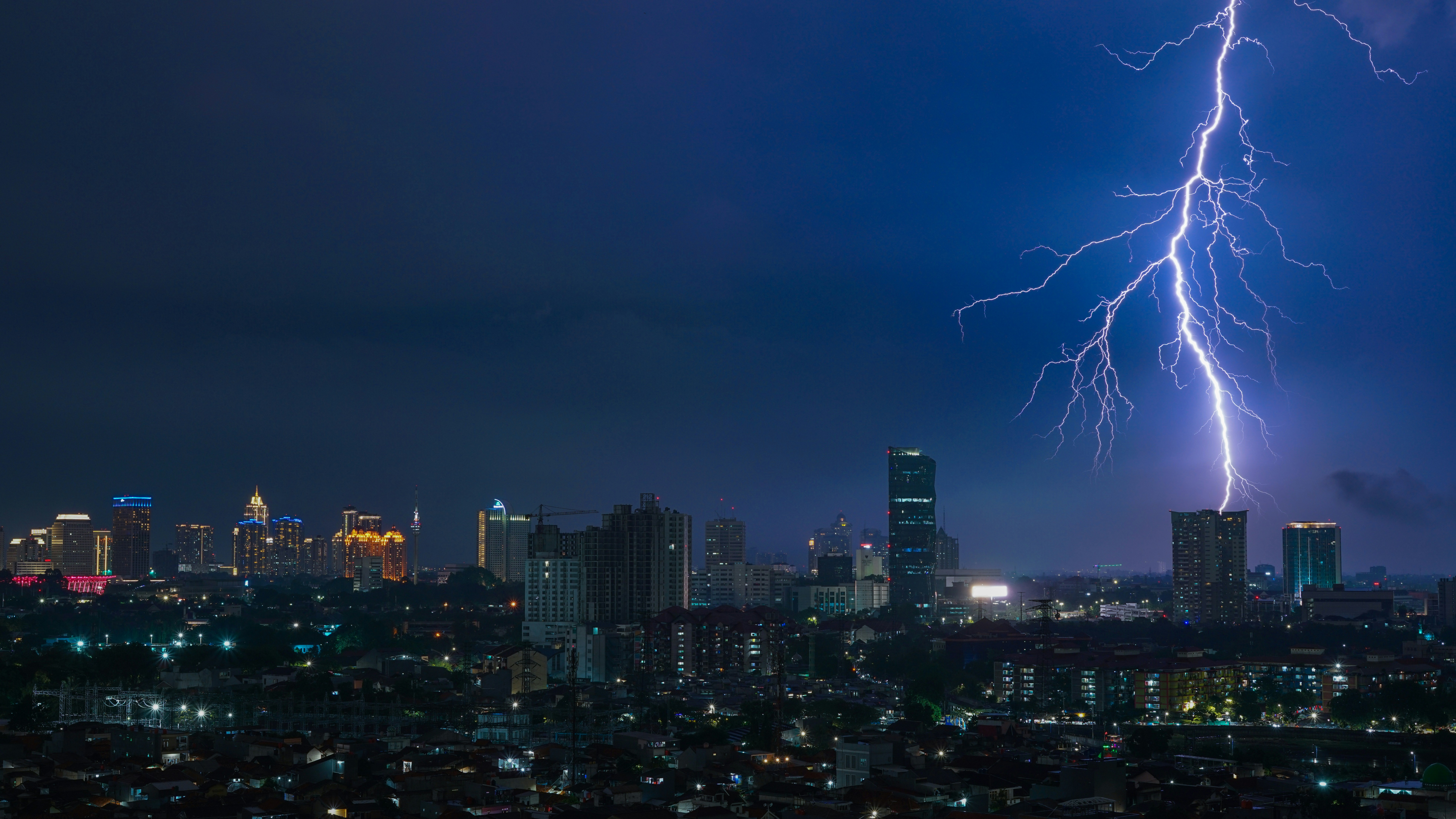 a city with lightning striking the ground