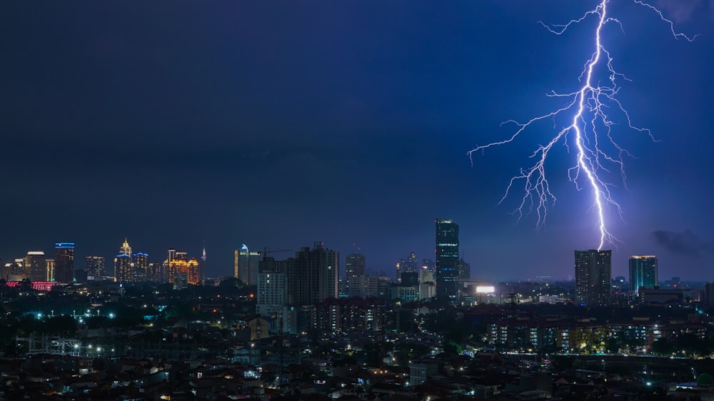 a city with lightning striking the ground