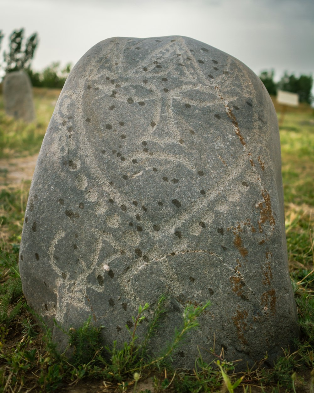 a stone with a cross on it