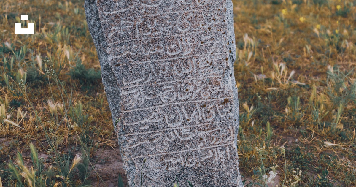 A stone with writing on it photo – Free Kyrgyzstan Image on Unsplash
