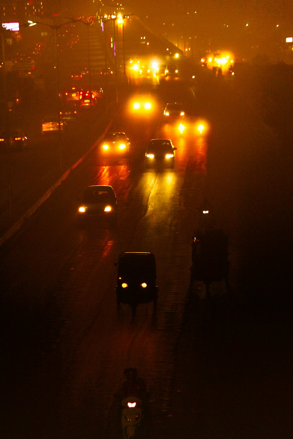 a street with cars on it at night