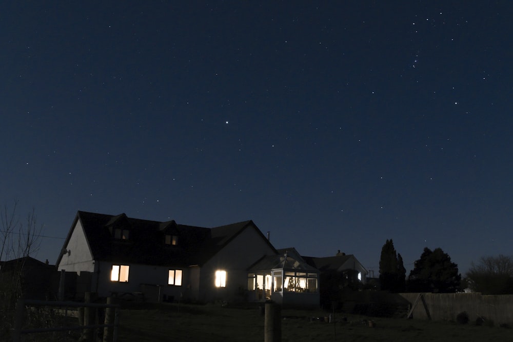 a house with a starry sky above it