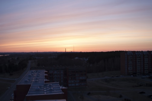 A panoramic shot of a vast luxury residential complex at sunset