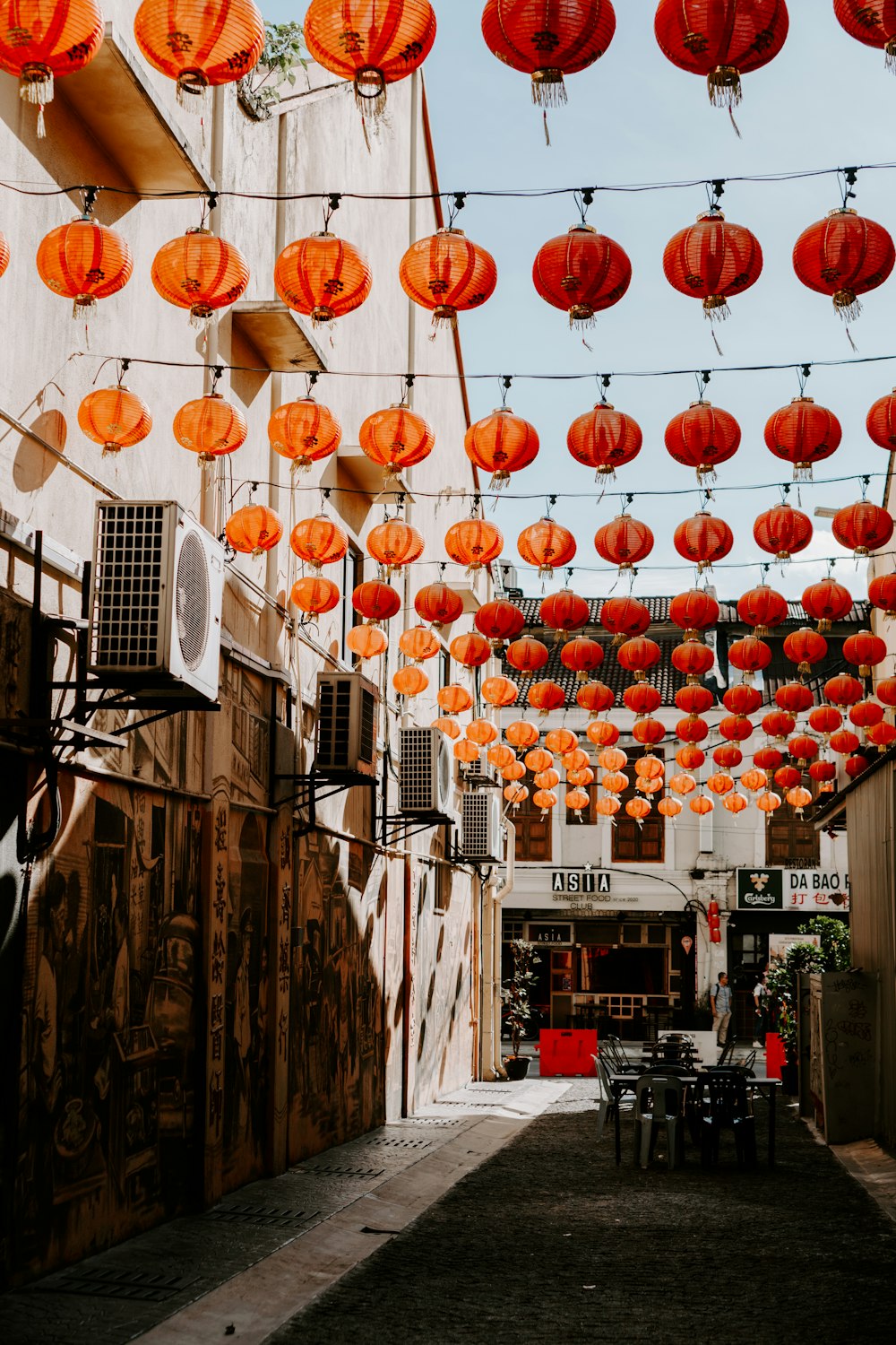 a building with lanterns from the ceiling