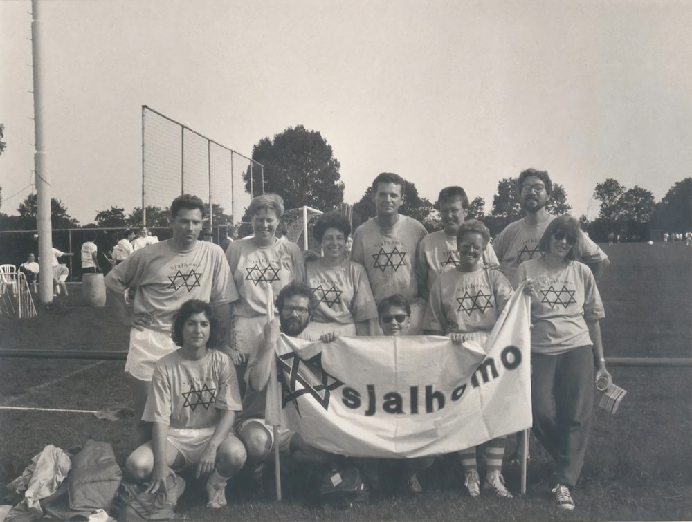 a group of people holding a banner