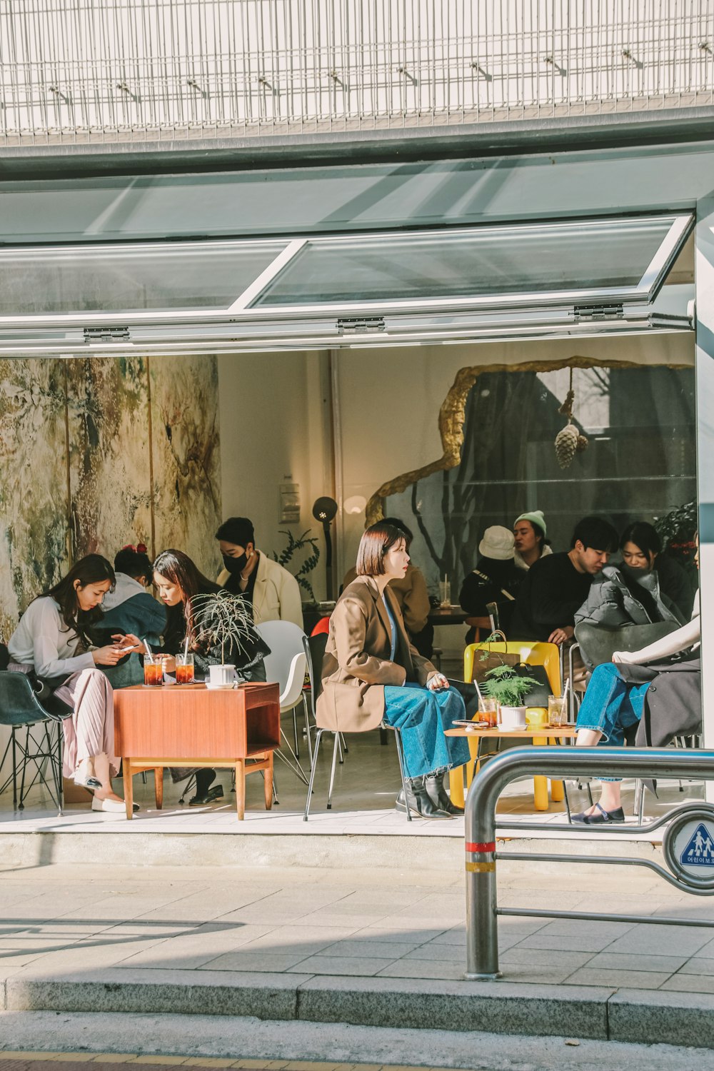 a group of people sitting outside a building