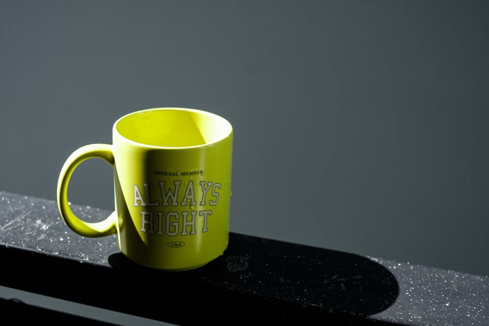 a yellow coffee cup