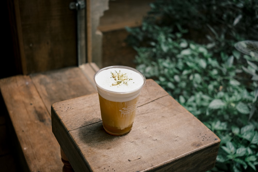 a glass of beer on a table