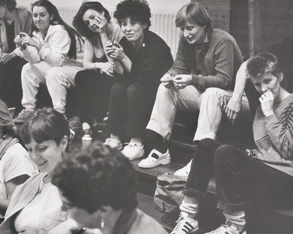 a group of people sitting on the ground