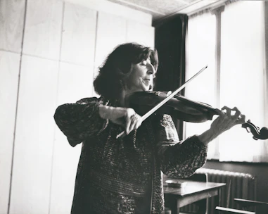 Bright, inviting violin practice room with wooden floors and natural light.
