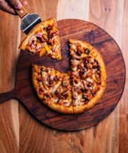 a pizza being cut