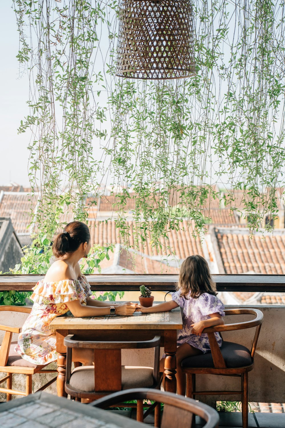 a person and a child sitting at a table