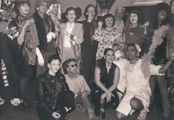 Group photo of the entire cast dressed in character costumes.