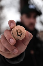 a person holding a coin