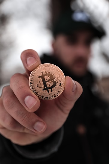 a person holding a coin