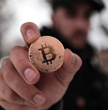 a person holding a coin