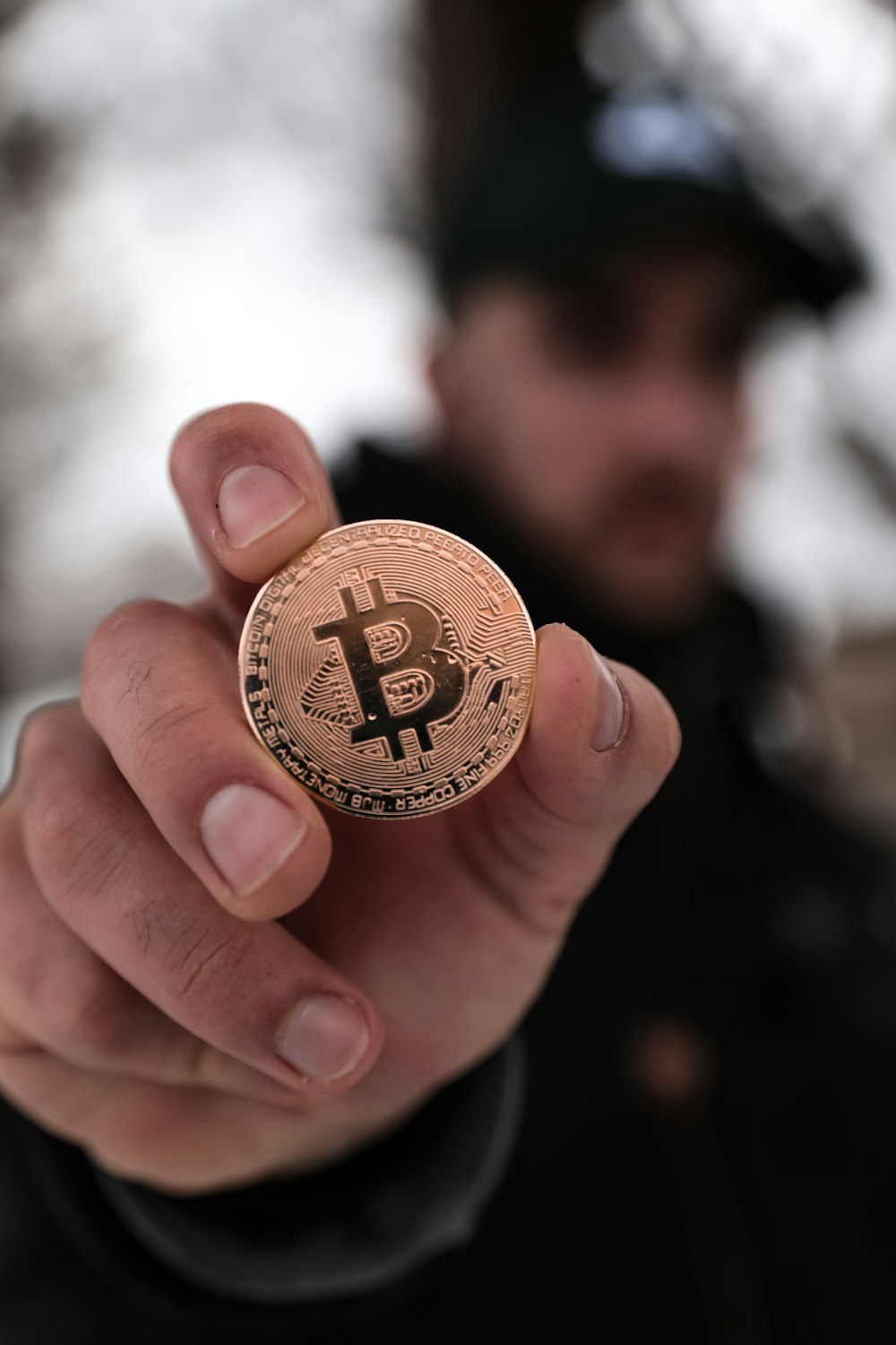 a person holding a coin