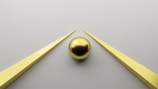 a coin next to a gold coin