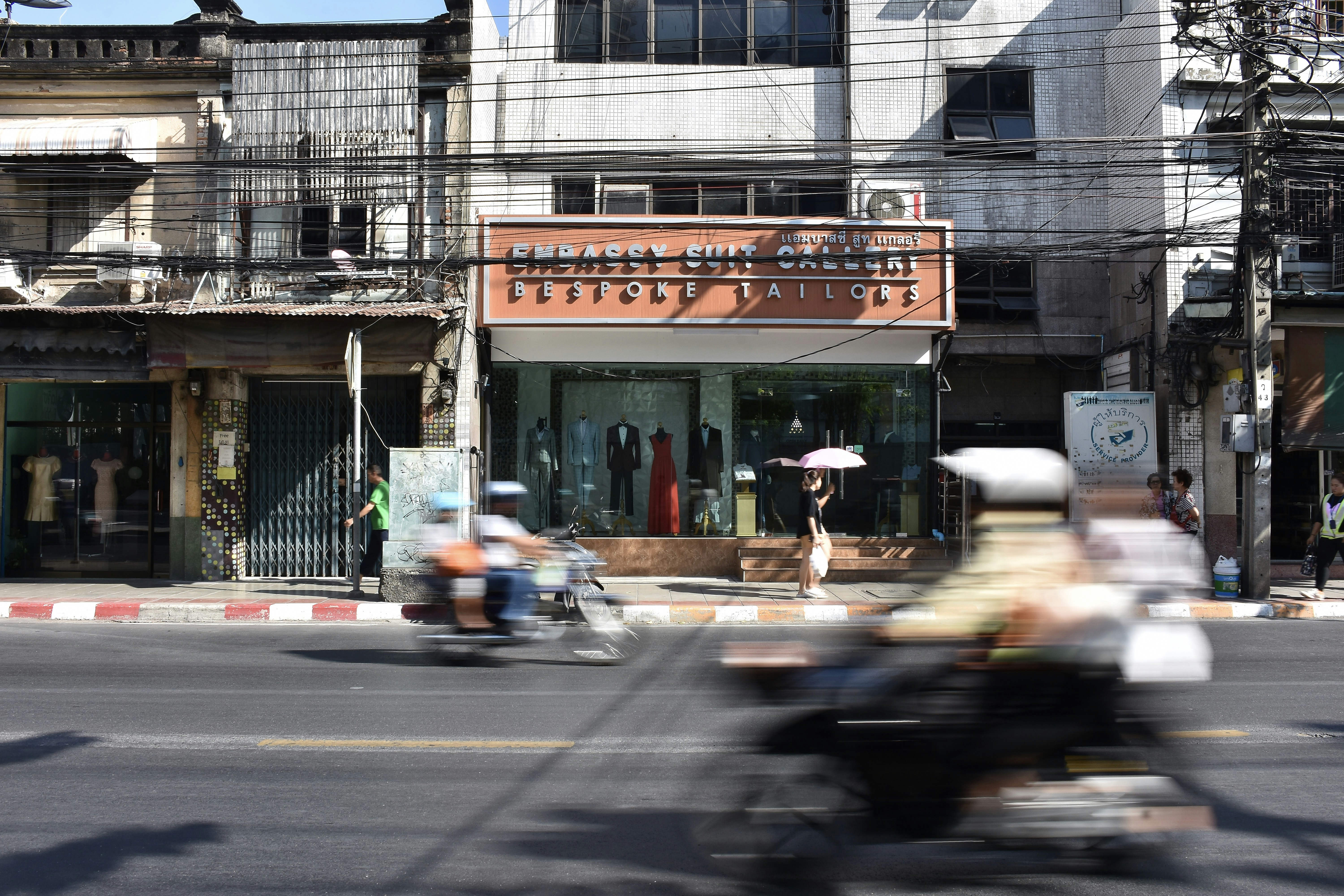 a person riding a motorcycle down a street