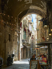 a narrow alleyway with shops