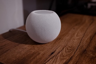 a white ball on a wooden surface