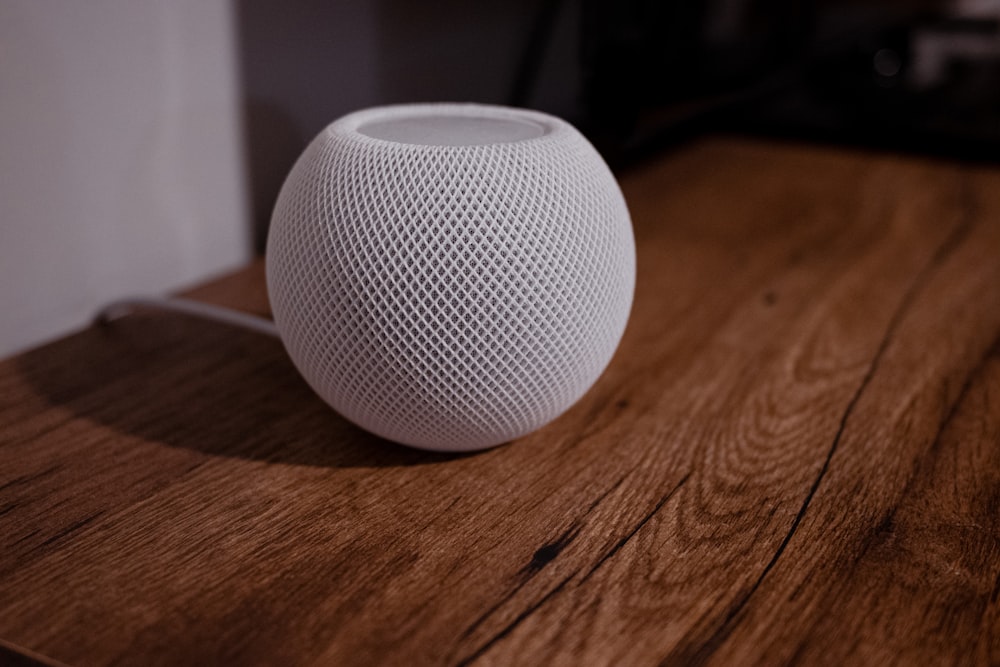 a white ball on a wooden surface