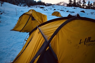 a couple of tents in the snow