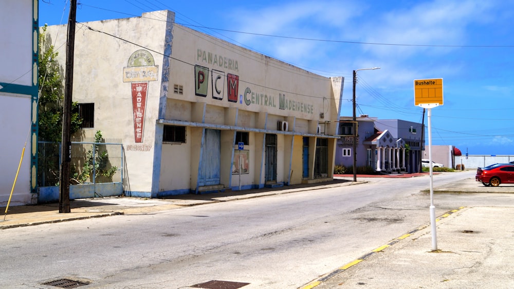 a white building with a sign on it