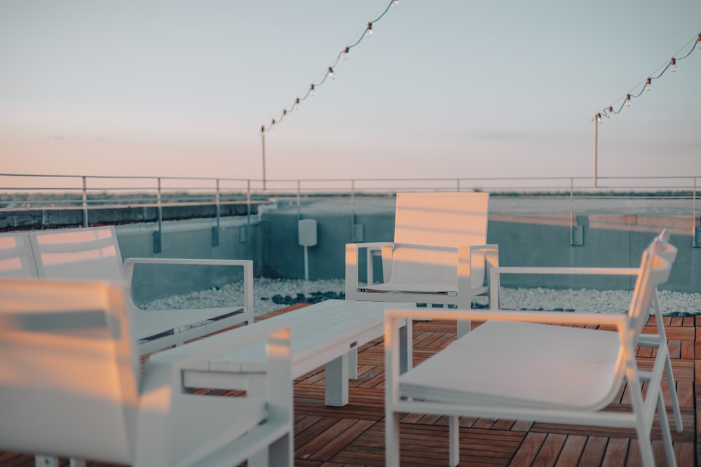 a deck with chairs and tables on it