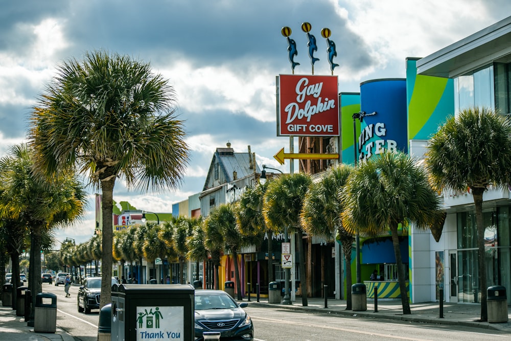 a street with palm trees and buildings