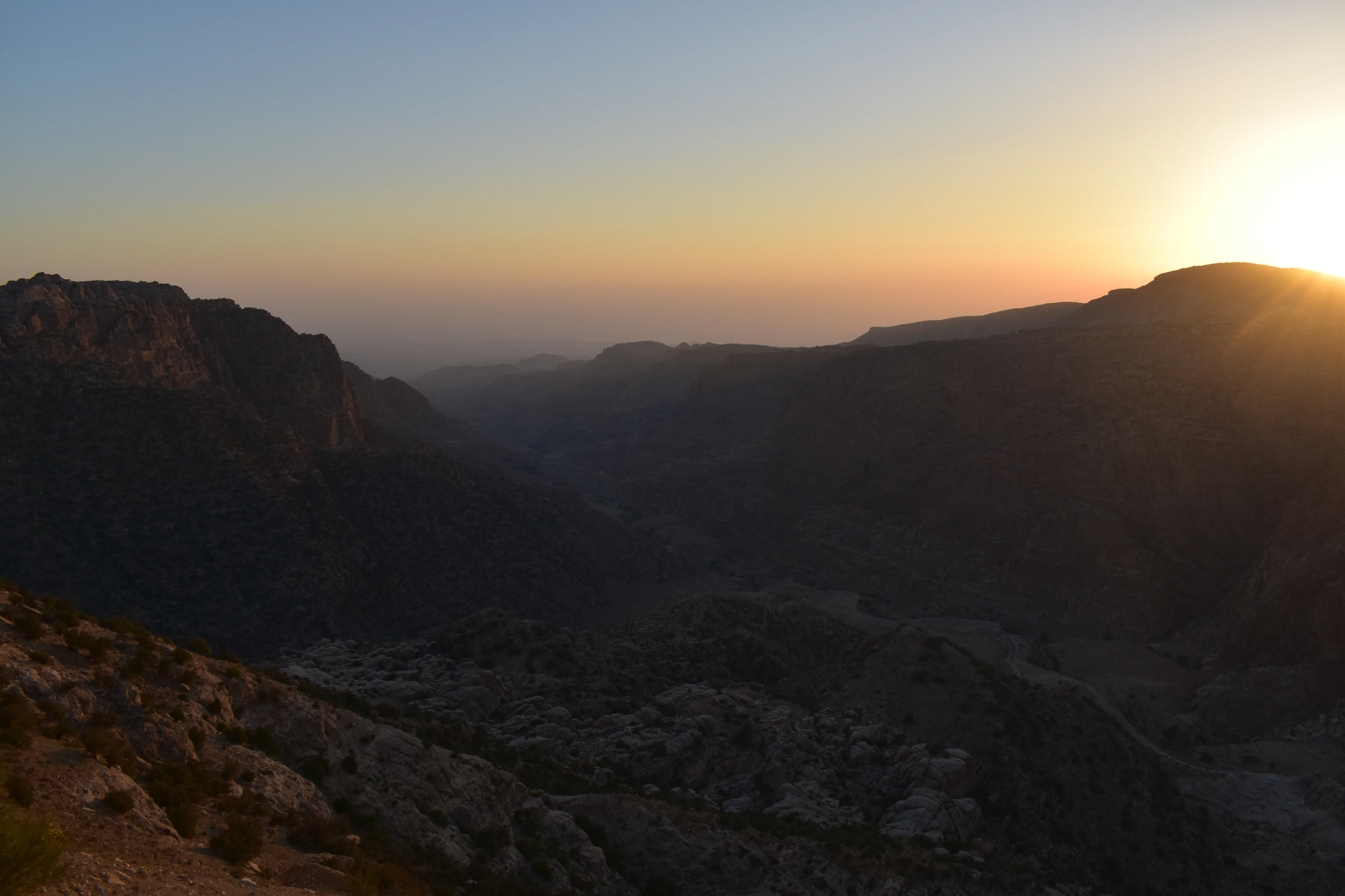 The sun setting over the hills of the Dana valley, Dana Biosphere Reserve