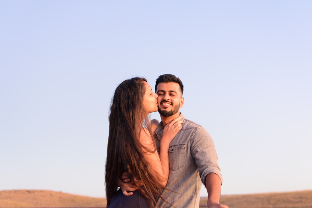 A romantic couple walking together at golden hour