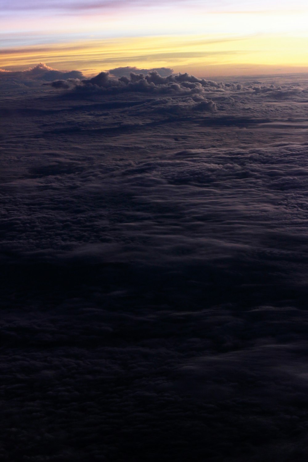 a view of the clouds and the sun