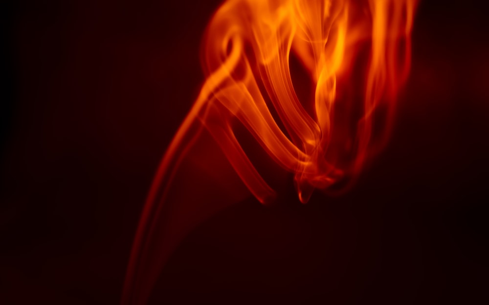 a red flame on a black background