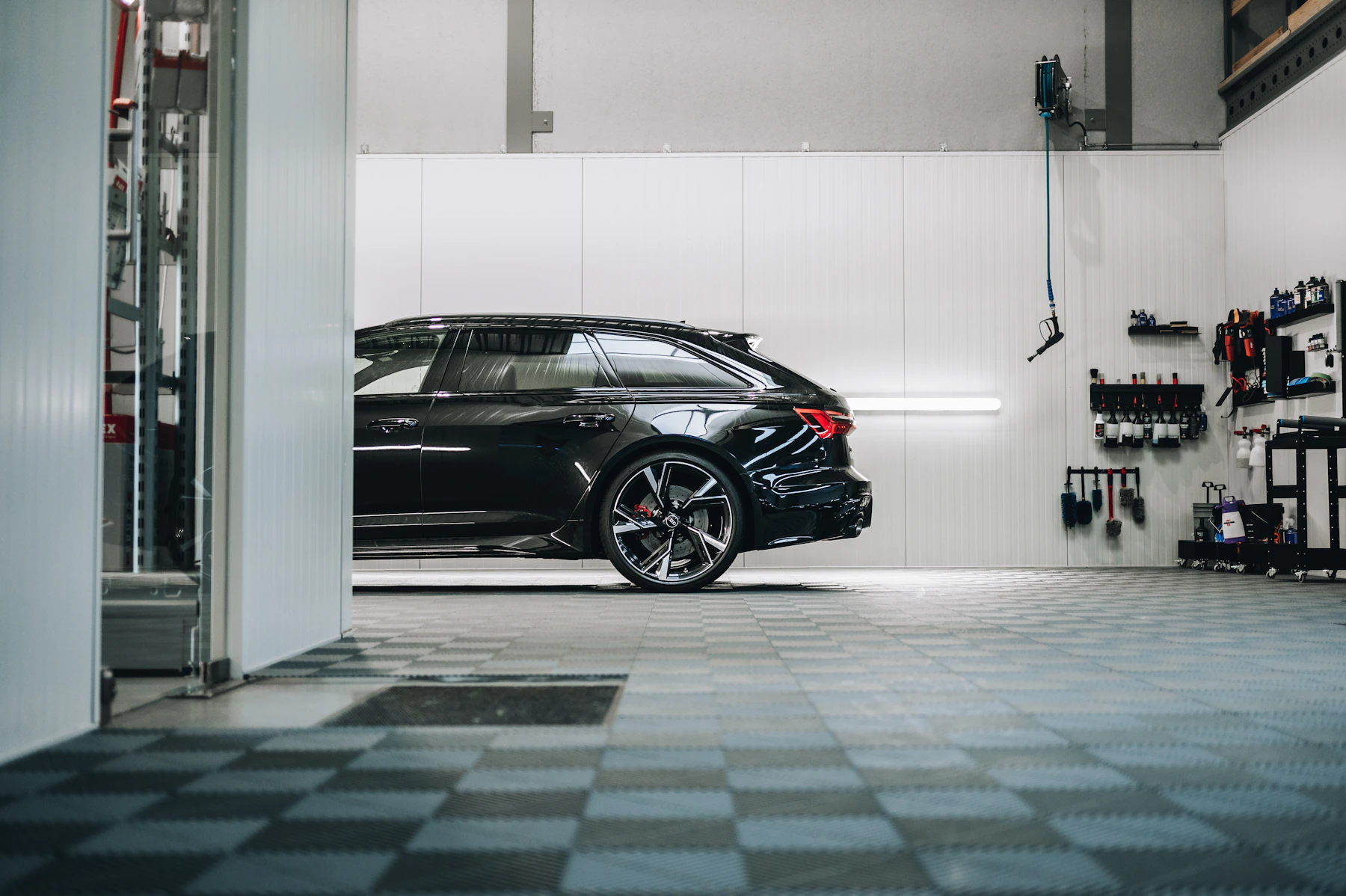Black Audi RS6 parked in a garage