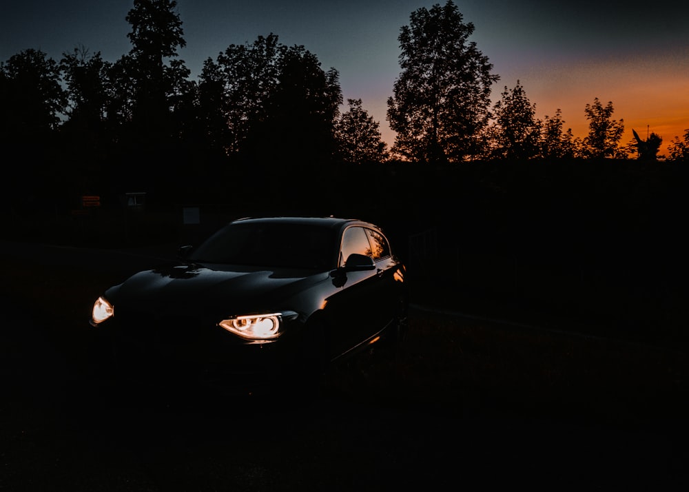 a car parked in a driveway at night