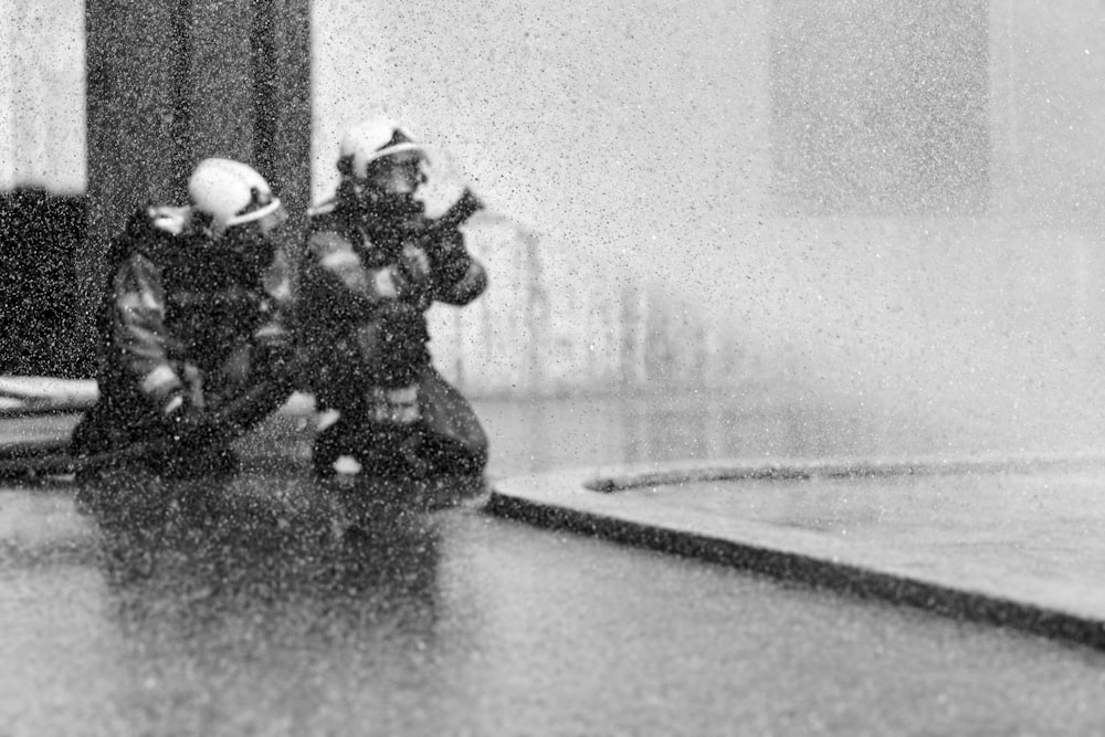 a couple of people in helmets