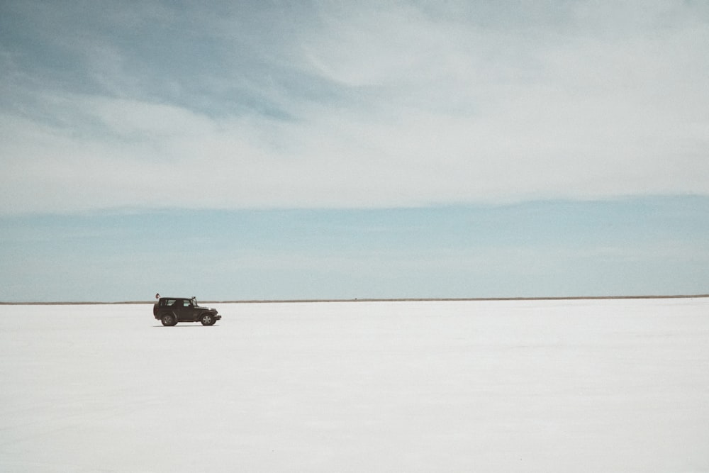 a car driving on a snowy road