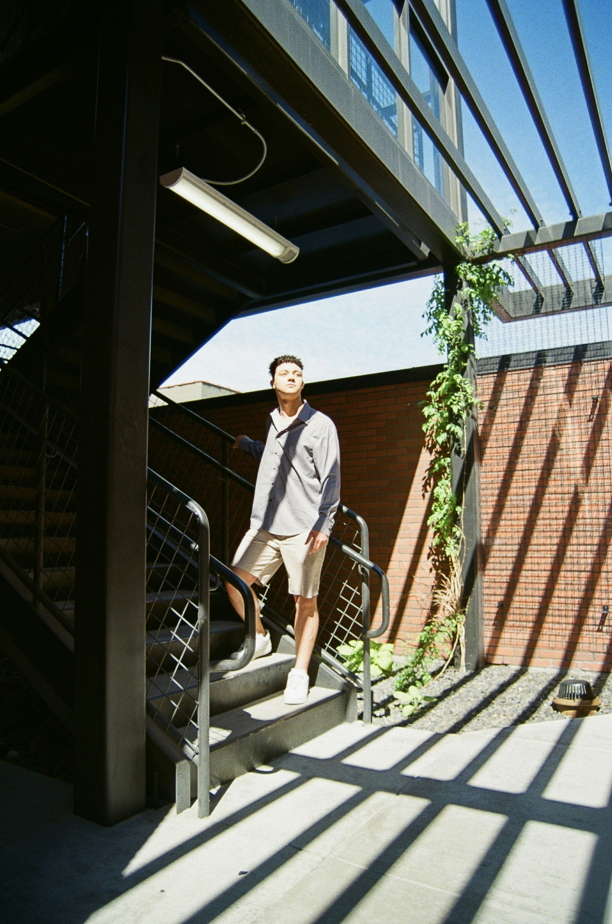 A man standing on a metal railing photo – Free Spokane Image on Unsplash